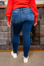 Dark blue skinny jeans with high waist, front pockets, slim tapered legs