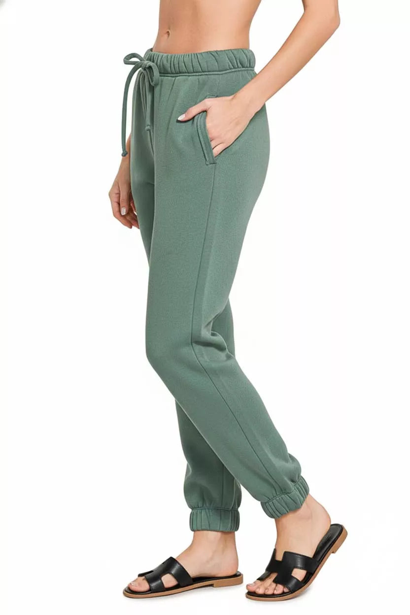 Ash jade fleece joggers with drawstring waist, side pockets, elastic cuffs