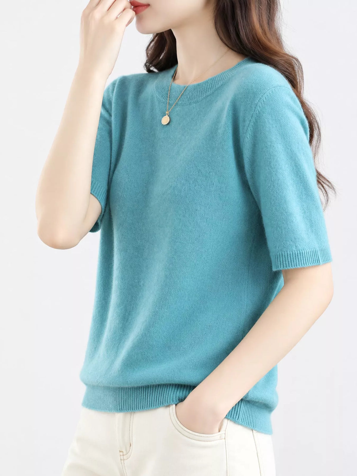 Teal round-neck short-sleeve knit sweater with ribbed neckline, cuffs, and hem