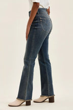 High-waist straight dark blue jeans with frayed hem and belt loops