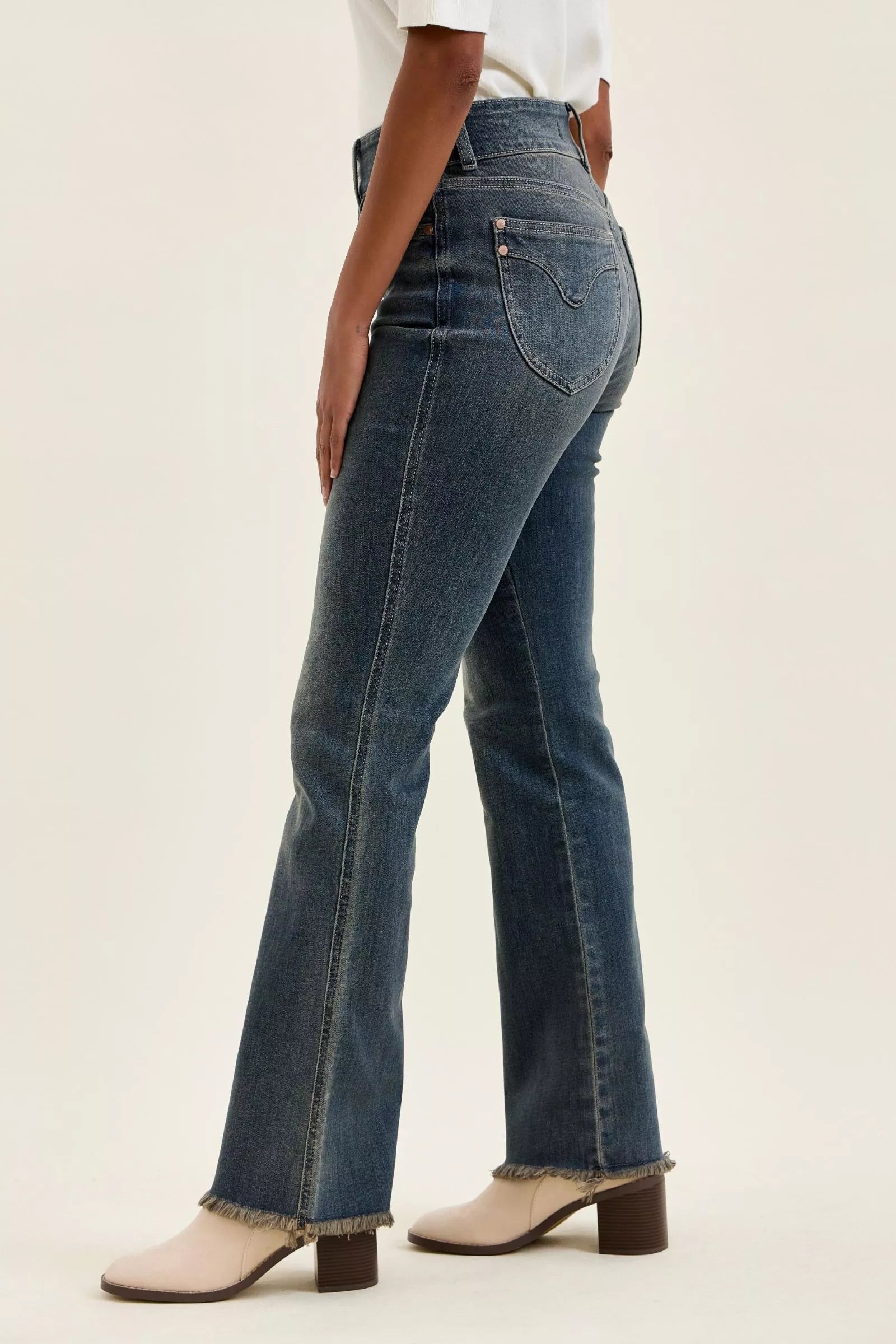 High-waist straight dark blue jeans with frayed hem and belt loops