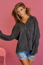 Charcoal textured knit hoodie with hood and buttoned placket, long sleeves