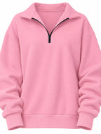 Pink oversized half-zip sweatshirt with stand collar and ribbed cuffs, relaxed
