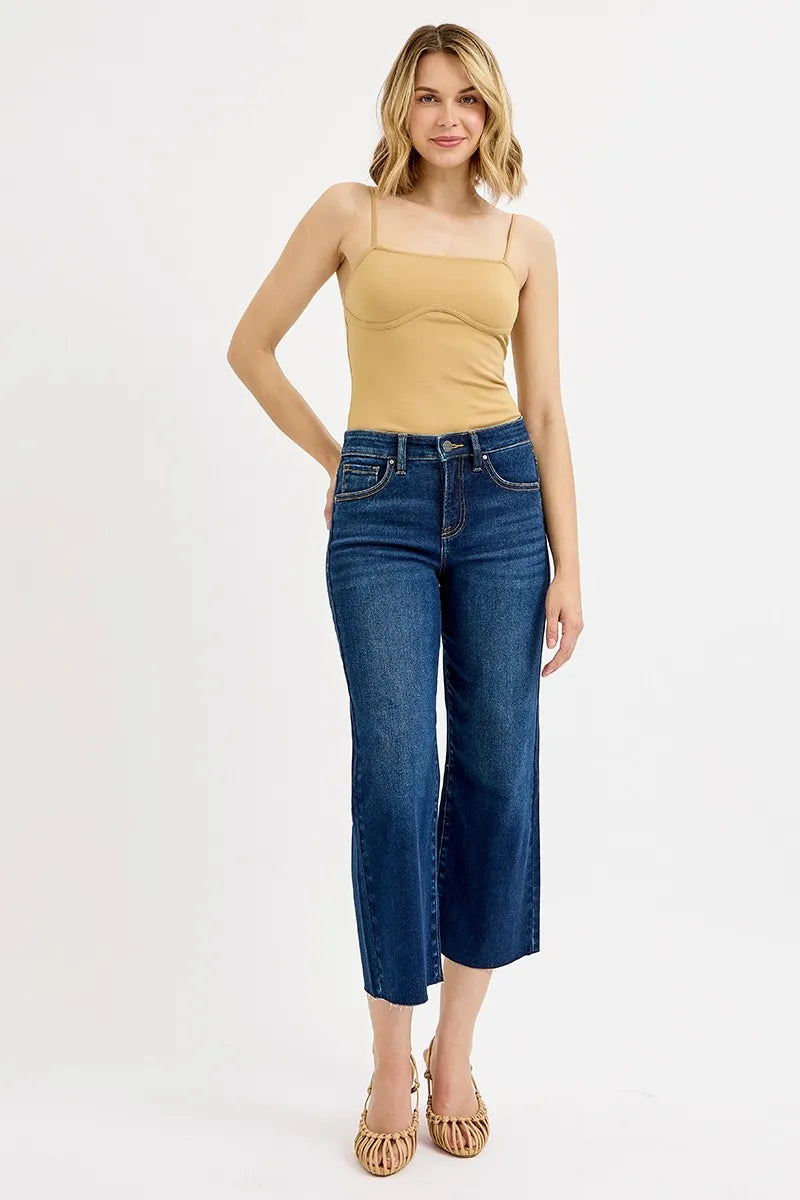 Risen high-rise crop wide-leg jeans in blue denim, worn with a camisole