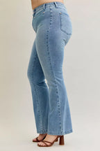 Light blue mid-rise bootcut jeans back side view with patch pocket and curved yoke seam