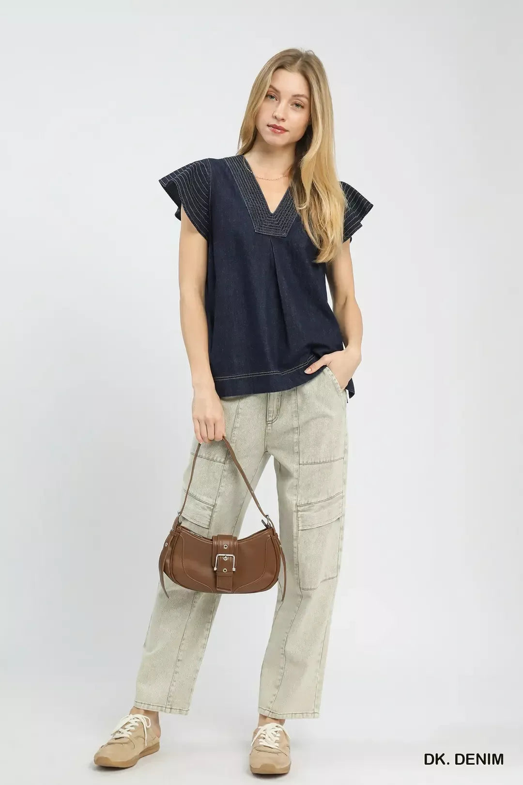 Dark denim cap-sleeve V-neck top worn with light cargo pants