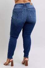 Thermal skinny jeans with high waist, dark blue denim, back view with pocket stitching