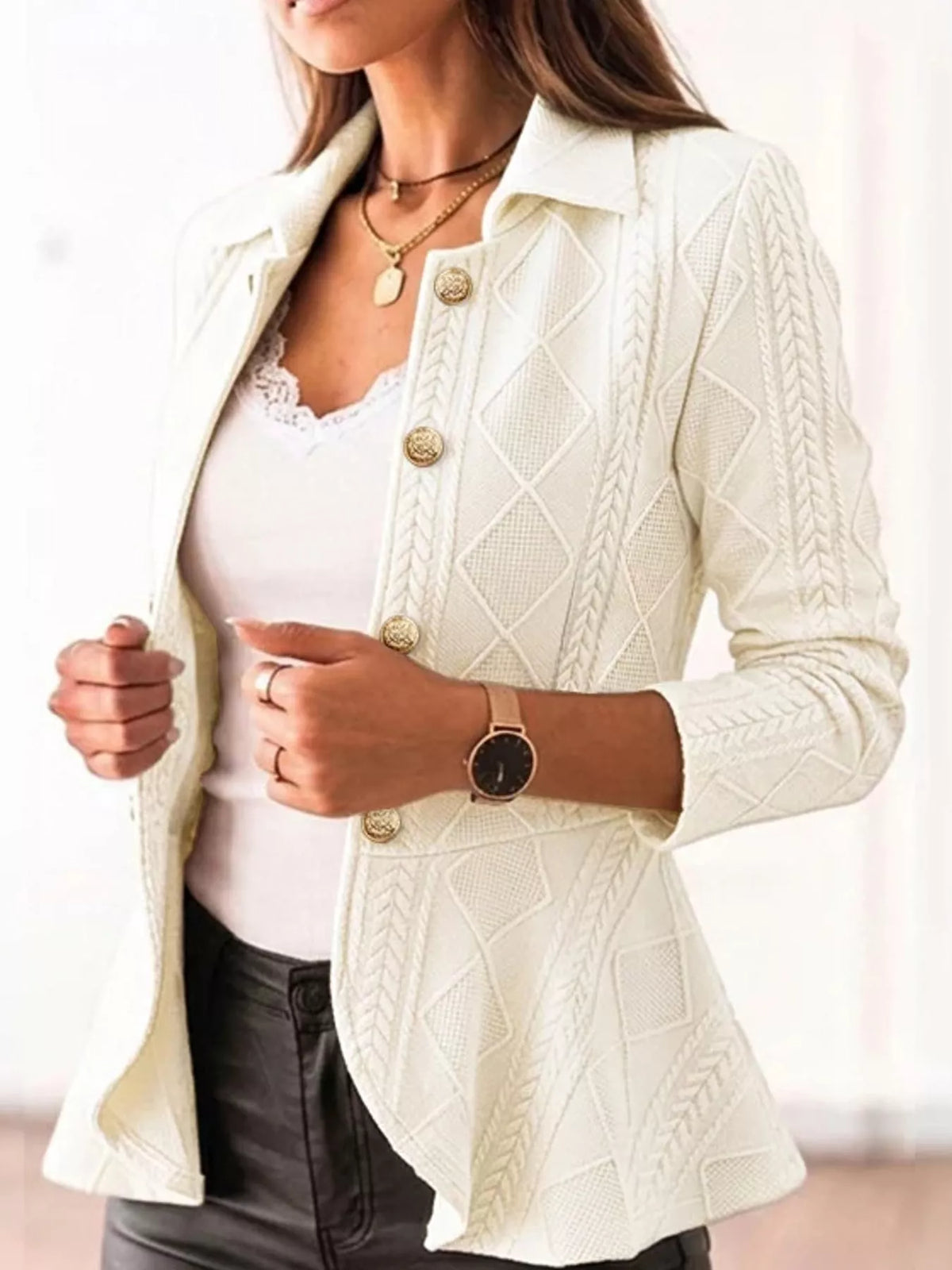 Cream/white cable-knit button-up cardigan with gold buttons and textured diamond pattern.