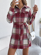 Burgundy plaid belted shirt dress with long sleeves, button front, shirttail hem.