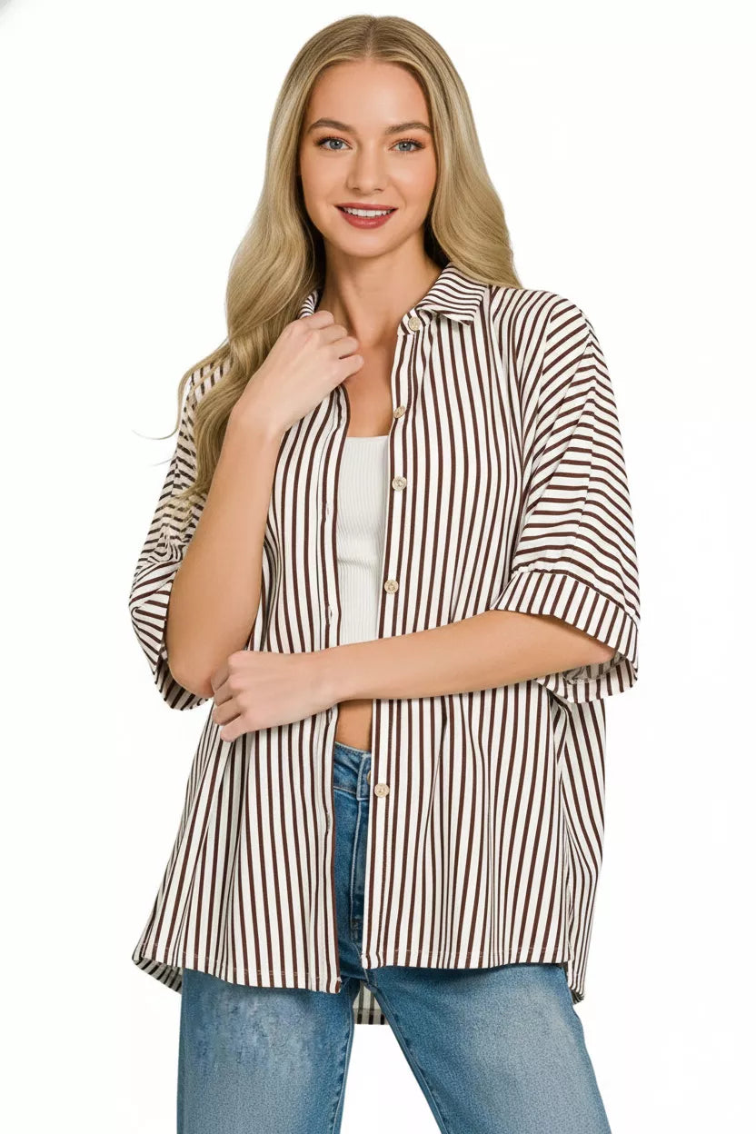 Women's oversized striped button-down shirt with open collar and button front, curved hem