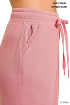Light rose joggers with drawstring waist and zip pocket