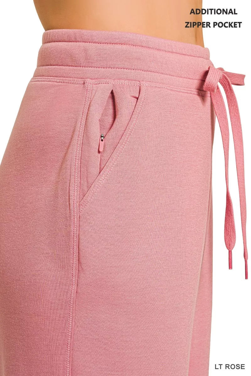 Light rose joggers with drawstring waist and zip pocket