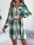 Green plaid belted shirt dress with button details, long sleeves, and chest pockets