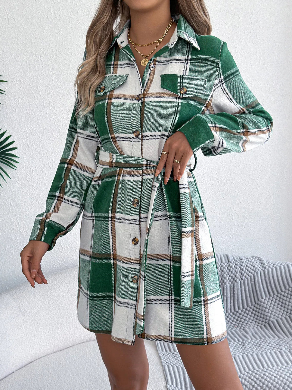 Green plaid belted shirt dress with button details, long sleeves, and chest pockets