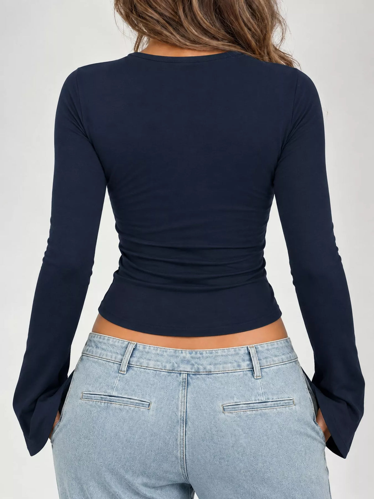 Navy lace-trim V-neck long-sleeve tee, back view with ruched waist