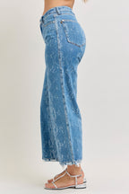 Light blue high-rise ankle wide-leg jeans, back view with snake print