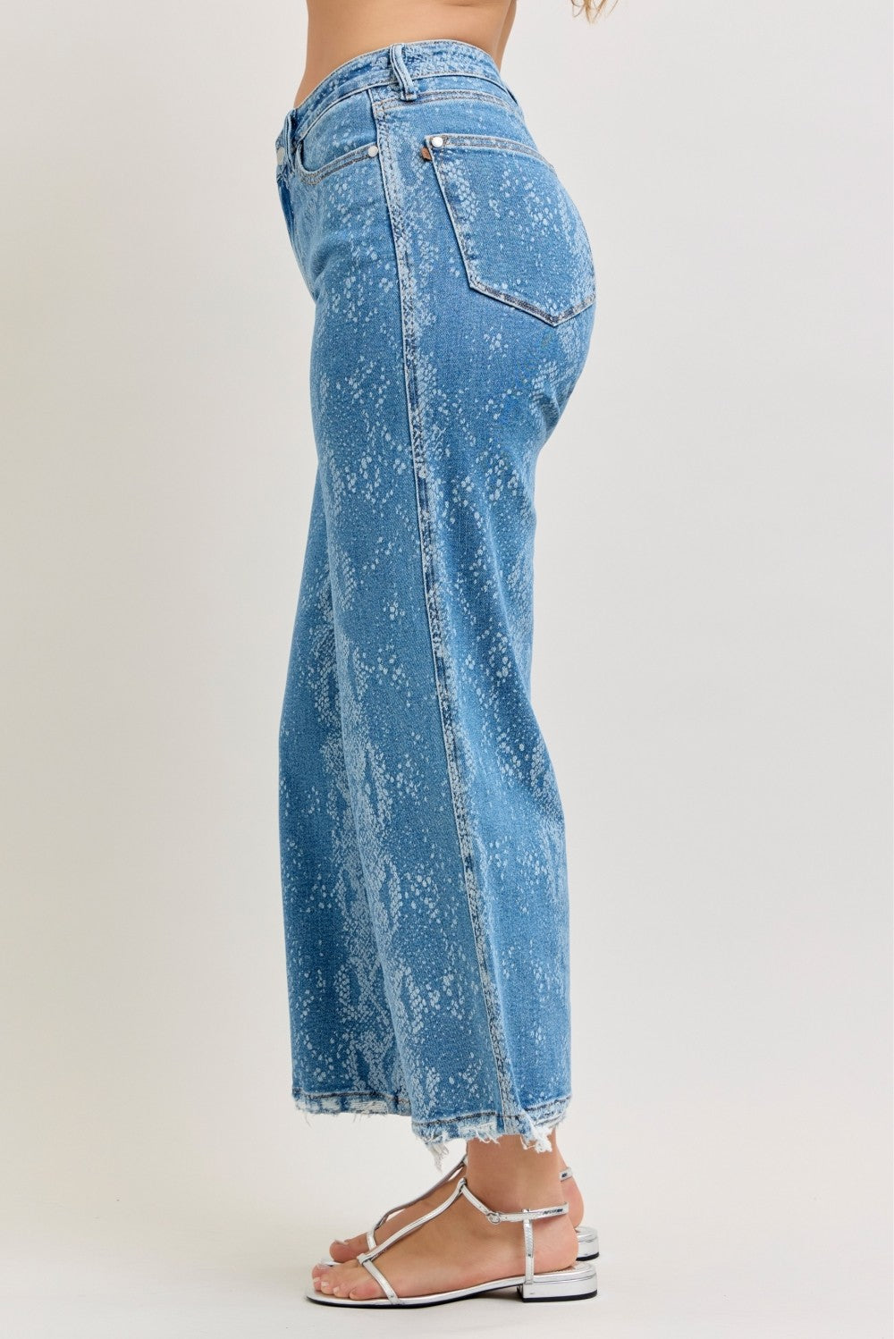 Light blue high-rise ankle wide-leg jeans, back view with snake print