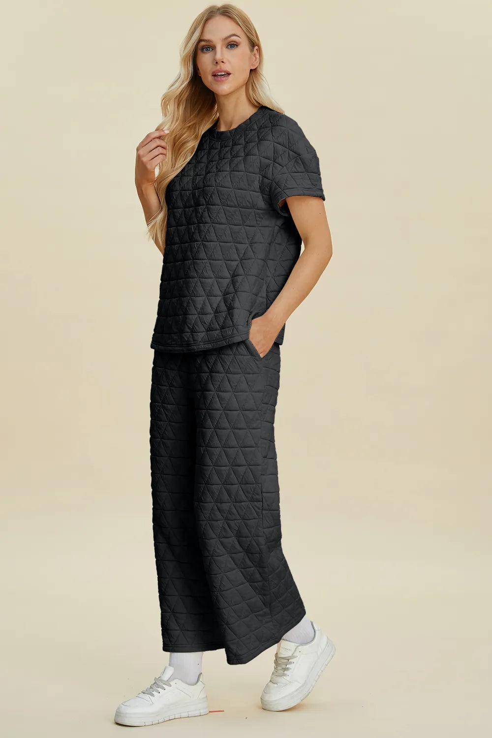 Black quilted round-neck top and wide-leg pants set with short sleeves