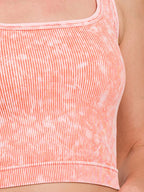 Women's coral washed ribbed seamless tank top detail at hem