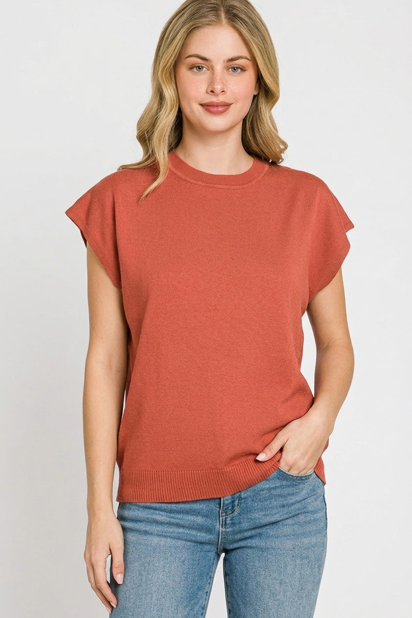 Ribbed cap sleeve crew neck pullover in rust knit with crew neckline and ribbed hem