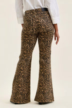 Leopard print flare jeans with high waist and wide bootcut-style hems.