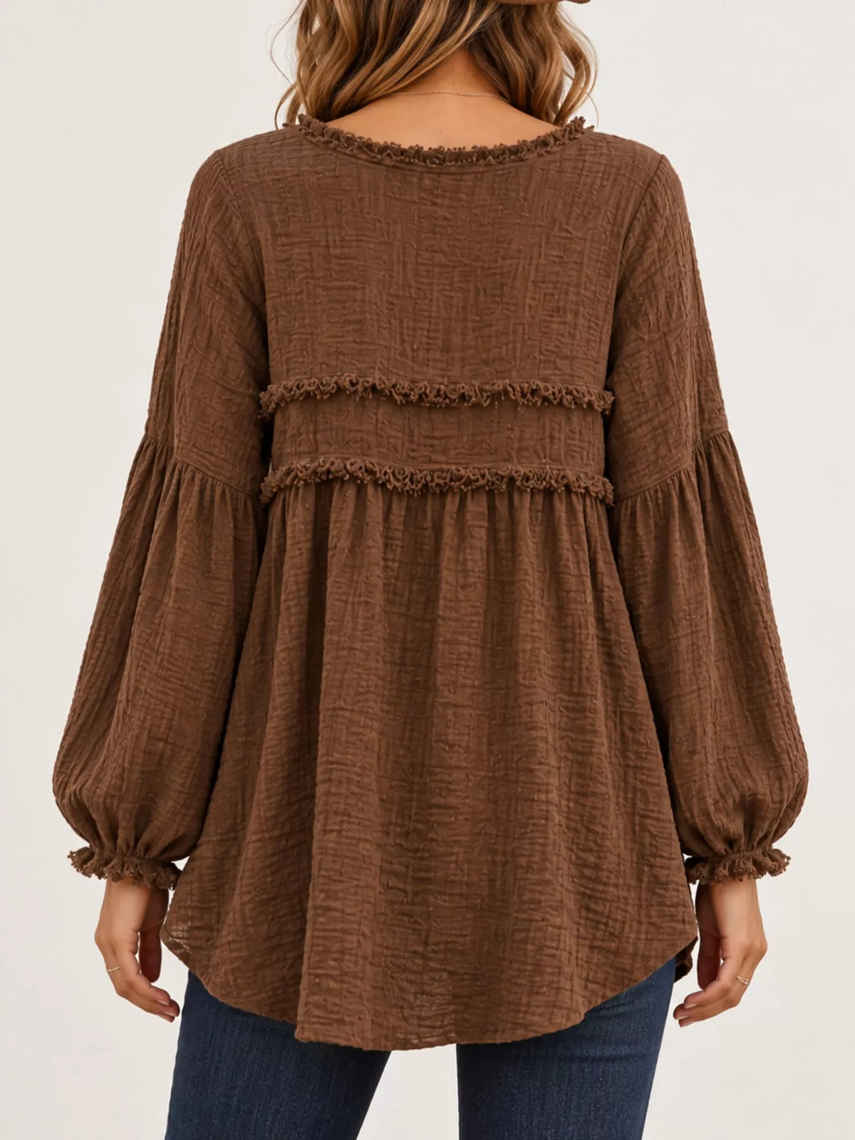 Brown peplum blouse back view with frayed yoke band and balloon sleeves
