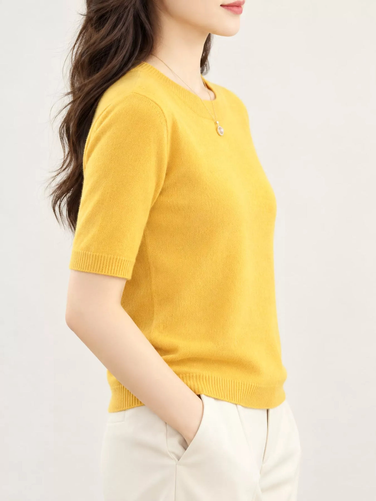 Mustard yellow round-neck short-sleeve knit sweater with ribbed neckline and hem