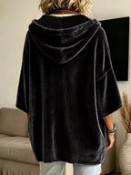 Black velvet hoodie with hood, front pocket, and short loose sleeves