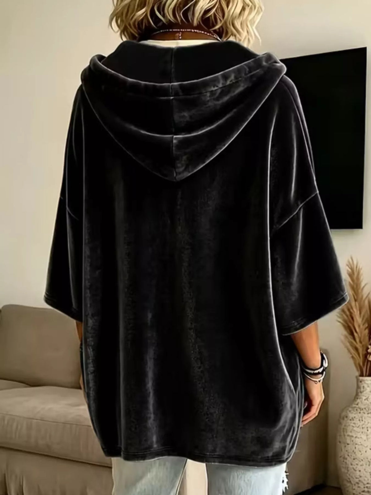 Black velvet hoodie with hood, front pocket, and short loose sleeves