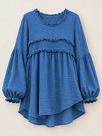 Blue peplum blouse with frayed ruffle trim and long puff sleeves, asymmetrical hem