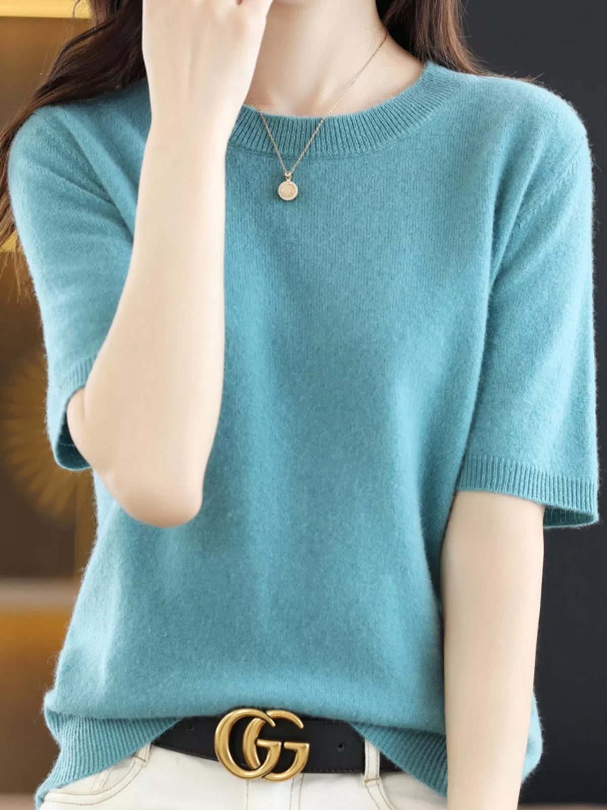 Teal round-neck short-sleeve knit sweater with ribbed crew neckline and hem