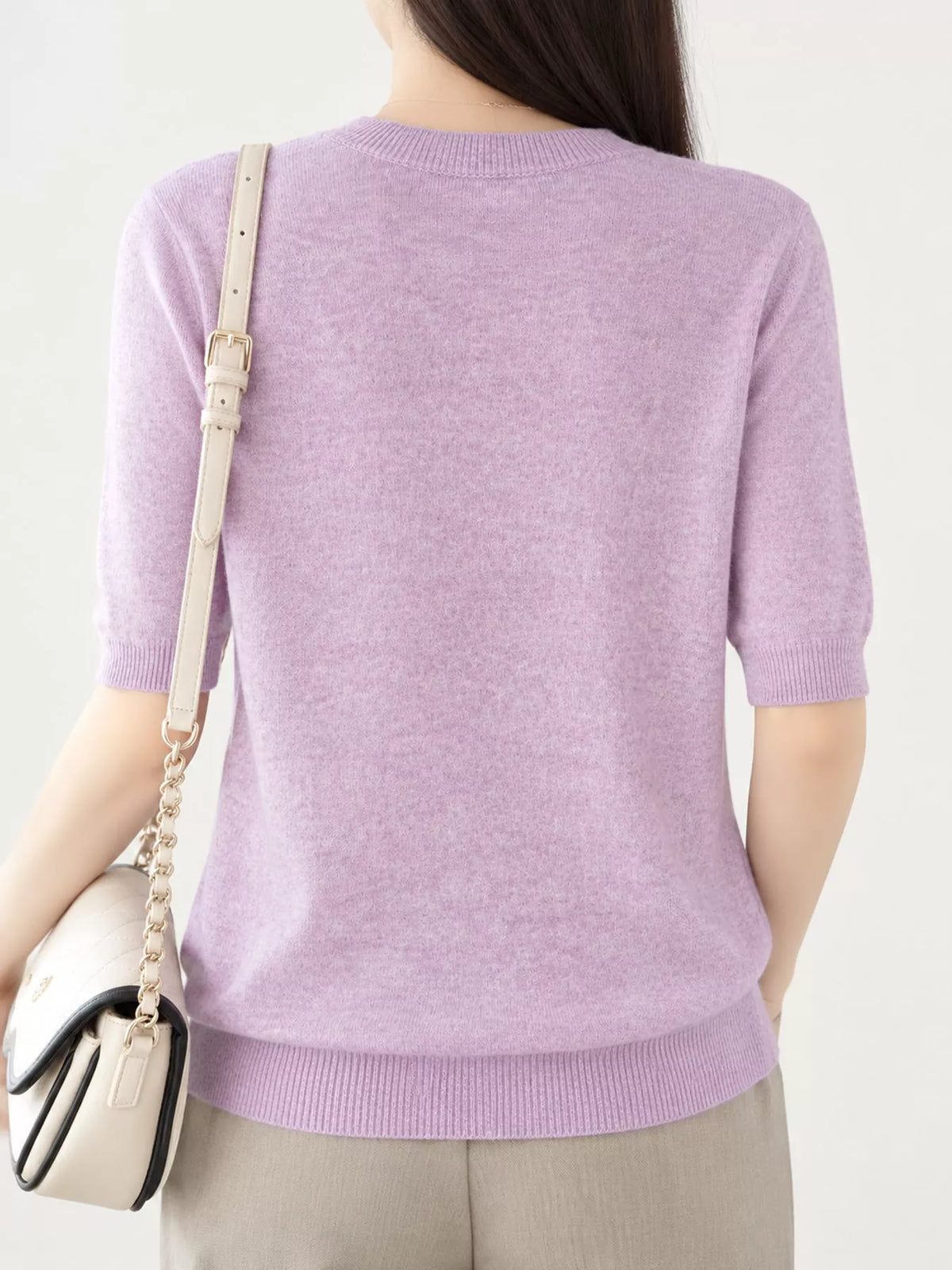 Dusty lavender round-neck short-sleeve sweater, back view with ribbed hem