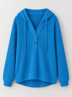 Bright blue waffle-knit button hoodie with hood, gold buttons, and drawstring ties.