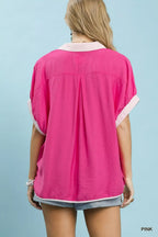 Pink oversized back top with contrast stripe trim on sleeves and yoke seam
