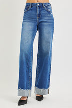 High-rise wide-leg jeans, medium blue wash, cuffed frayed hem, five-pocket style