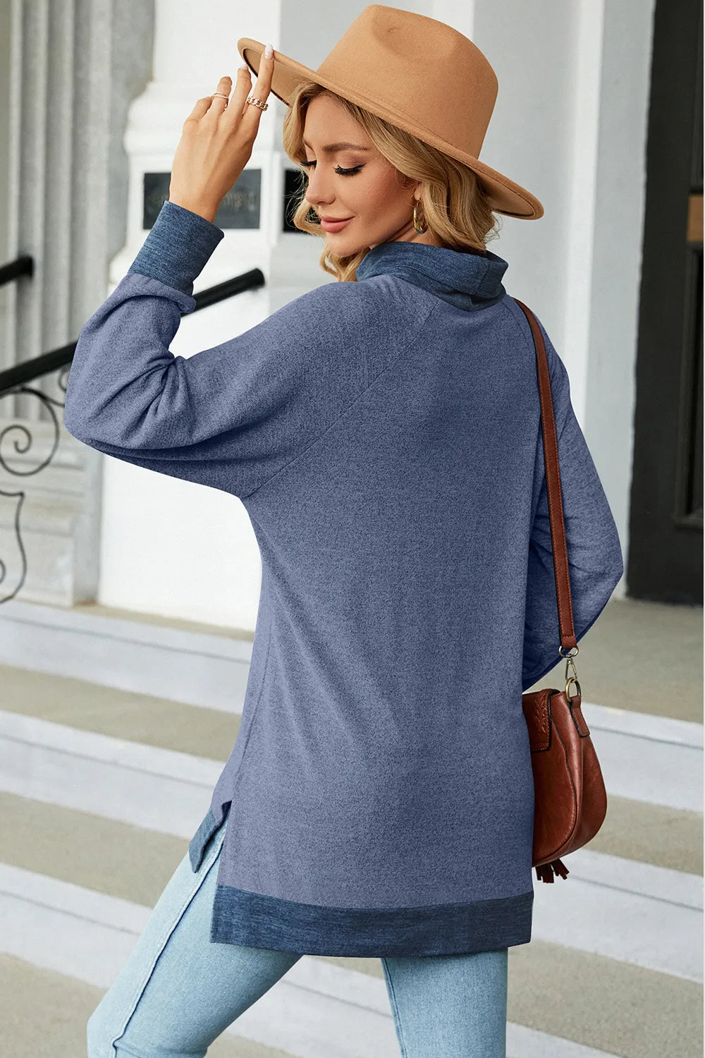 Light blue mock-neck long-sleeve slit tee with contrast hem band, back view