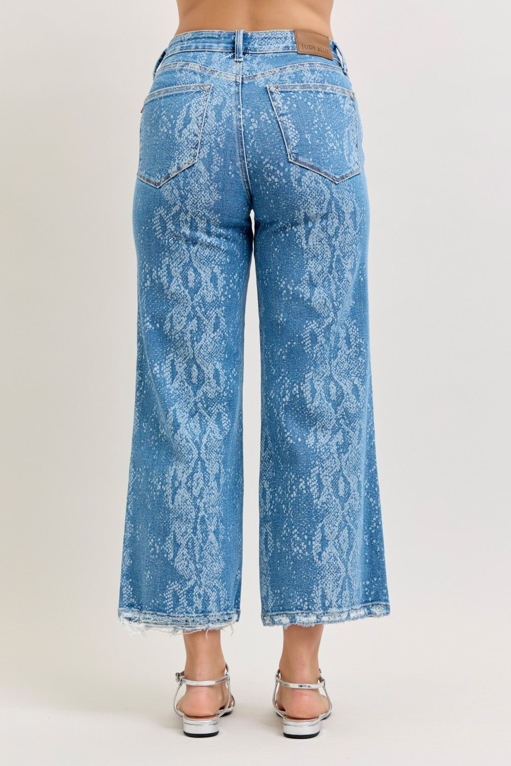 Light blue high-rise ankle wide-leg jeans with snake-print back pockets