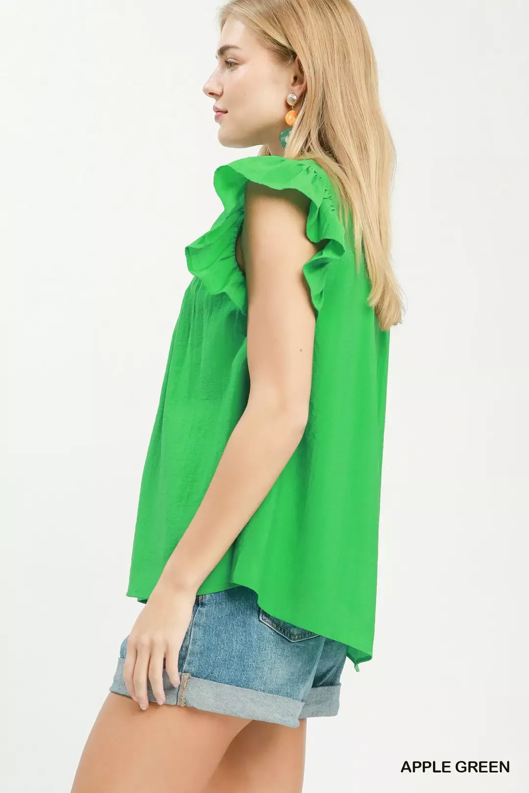 Green smocked yoke blouse with tiered ruffle sleeves and button front