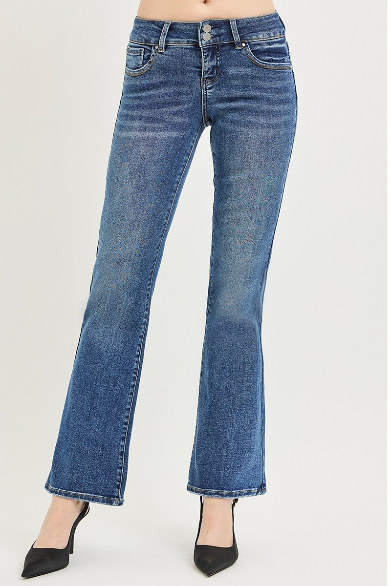 Medium wash low rise bootcut jeans with faded whisker-like markings and flared hem