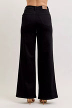 High-waisted wide-leg black denim jeans with front pockets and button closure