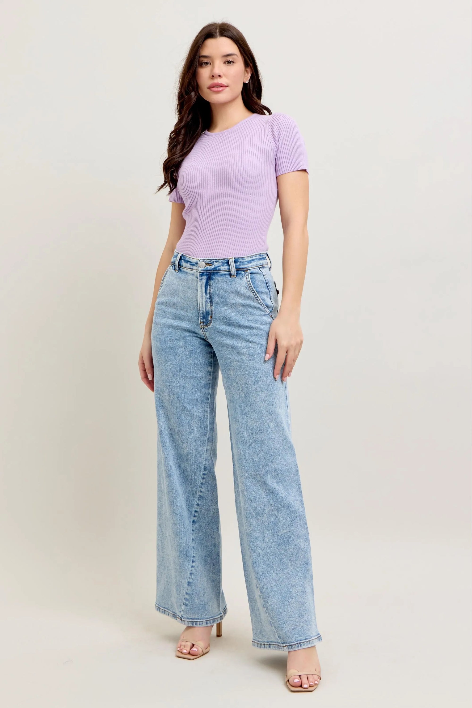 Plus size high-waist wide-leg jeans in light wash denim with front pockets