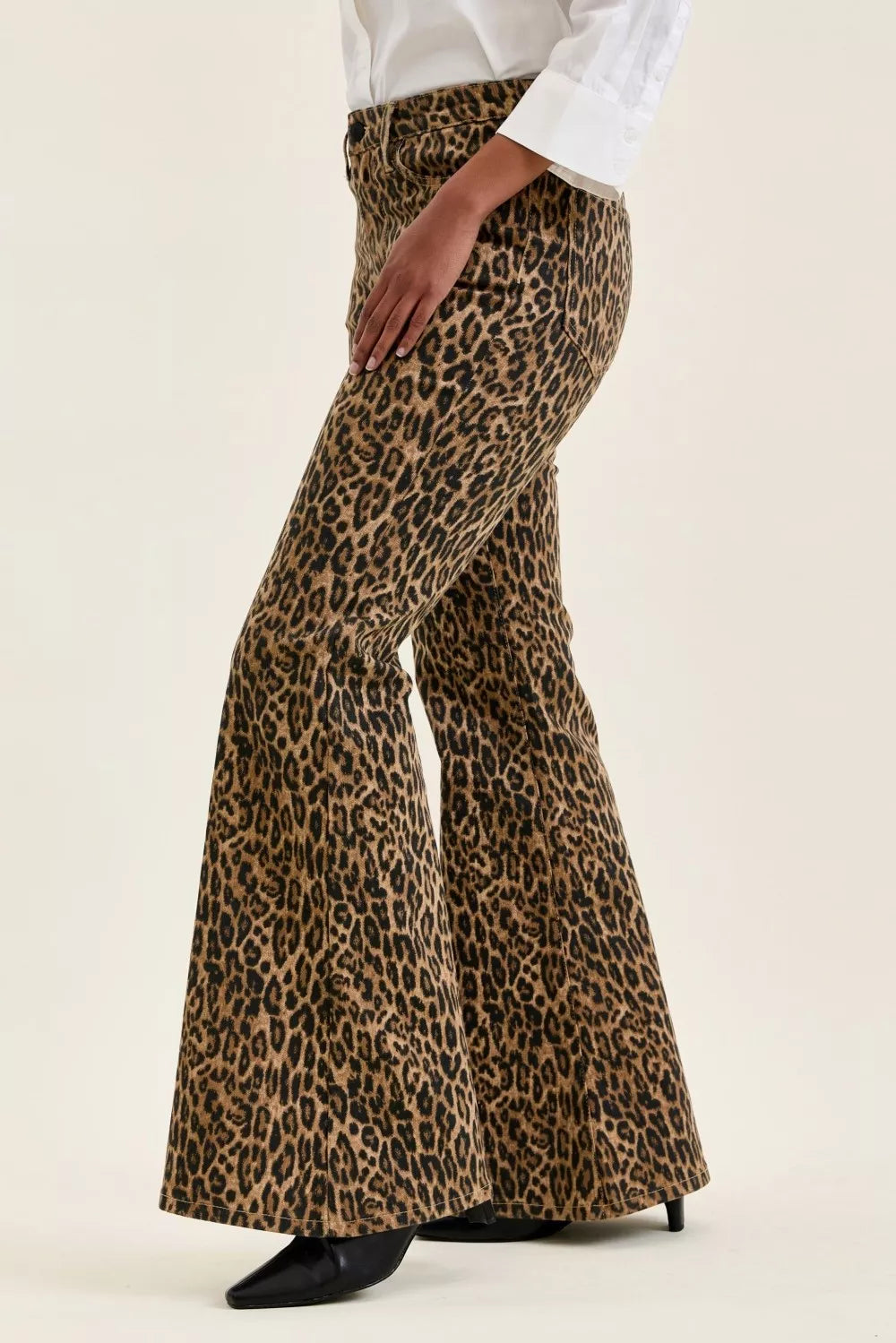 Leopard print flare jeans, high-rise fit, wide flared legs.