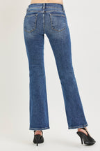 Medium wash low rise bootcut jeans, back view with two back pockets and belt loops