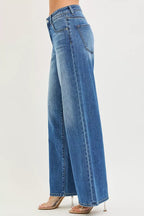 Women's medium-wash denim jeans back view, wide leg, belt loops, rear pocket