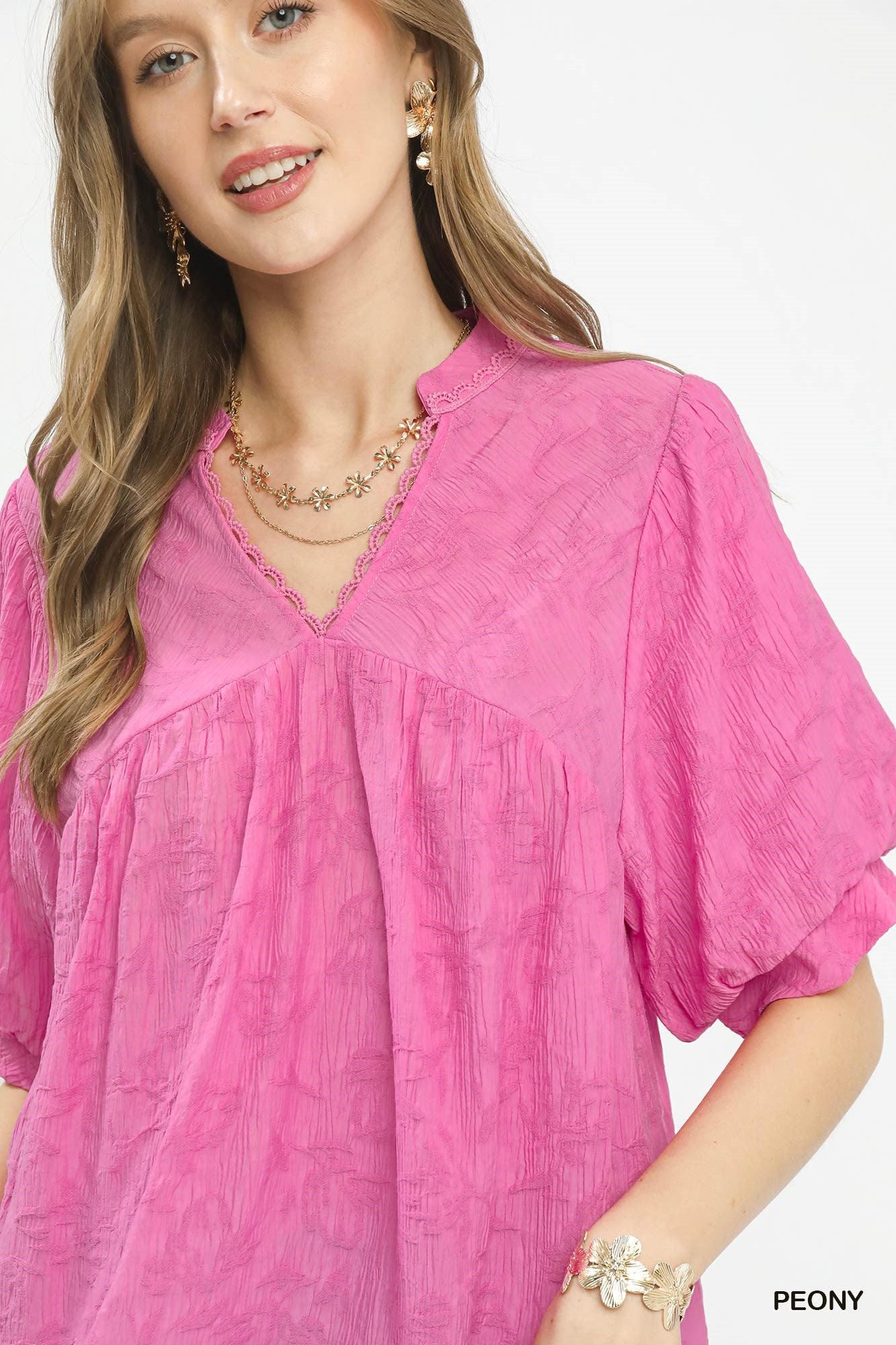 Pink blouse with lace-trim V neckline and gathered yoke, short puff sleeve