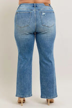 Medium blue high-waist straight jeans, back view with two back pockets and seams