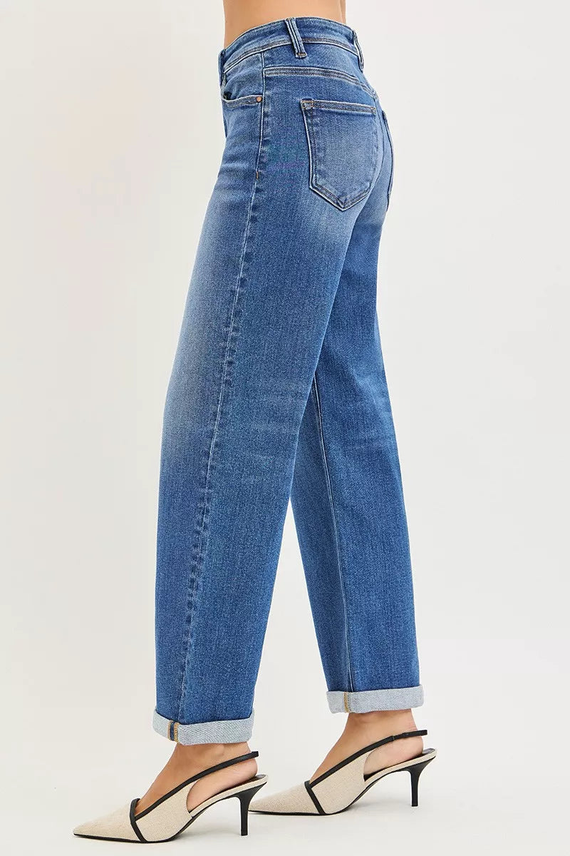 Blue denim jeans with back pocket seam detail and cuffed ankle hem