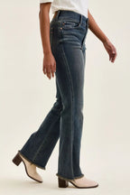 High-waist straight dark blue jeans with frayed hem and front patch details