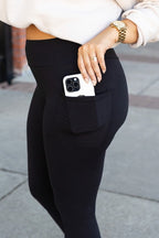 Black high-waist full-length leggings with side pocket and phone in pocket