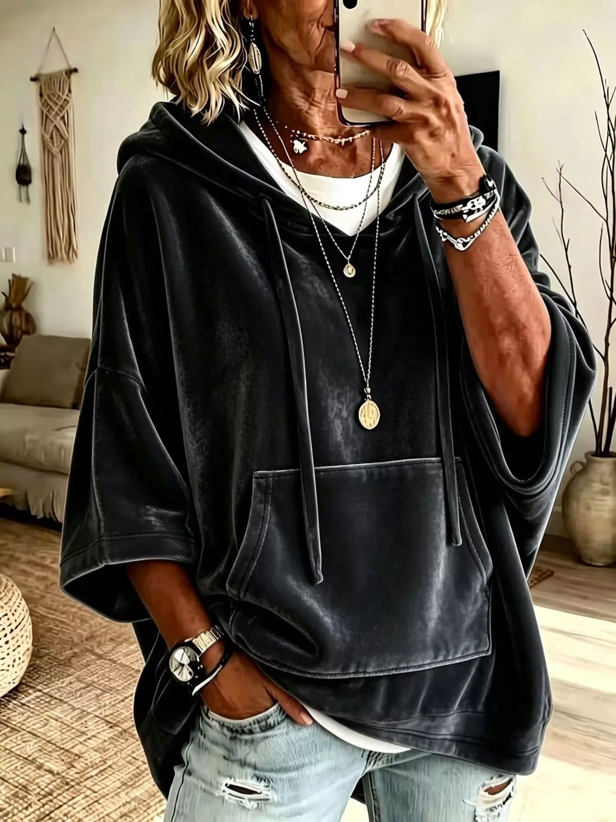 Black velvet kangaroo pocket hoodie with hood, drawstring ties, and front pouch pocket.
